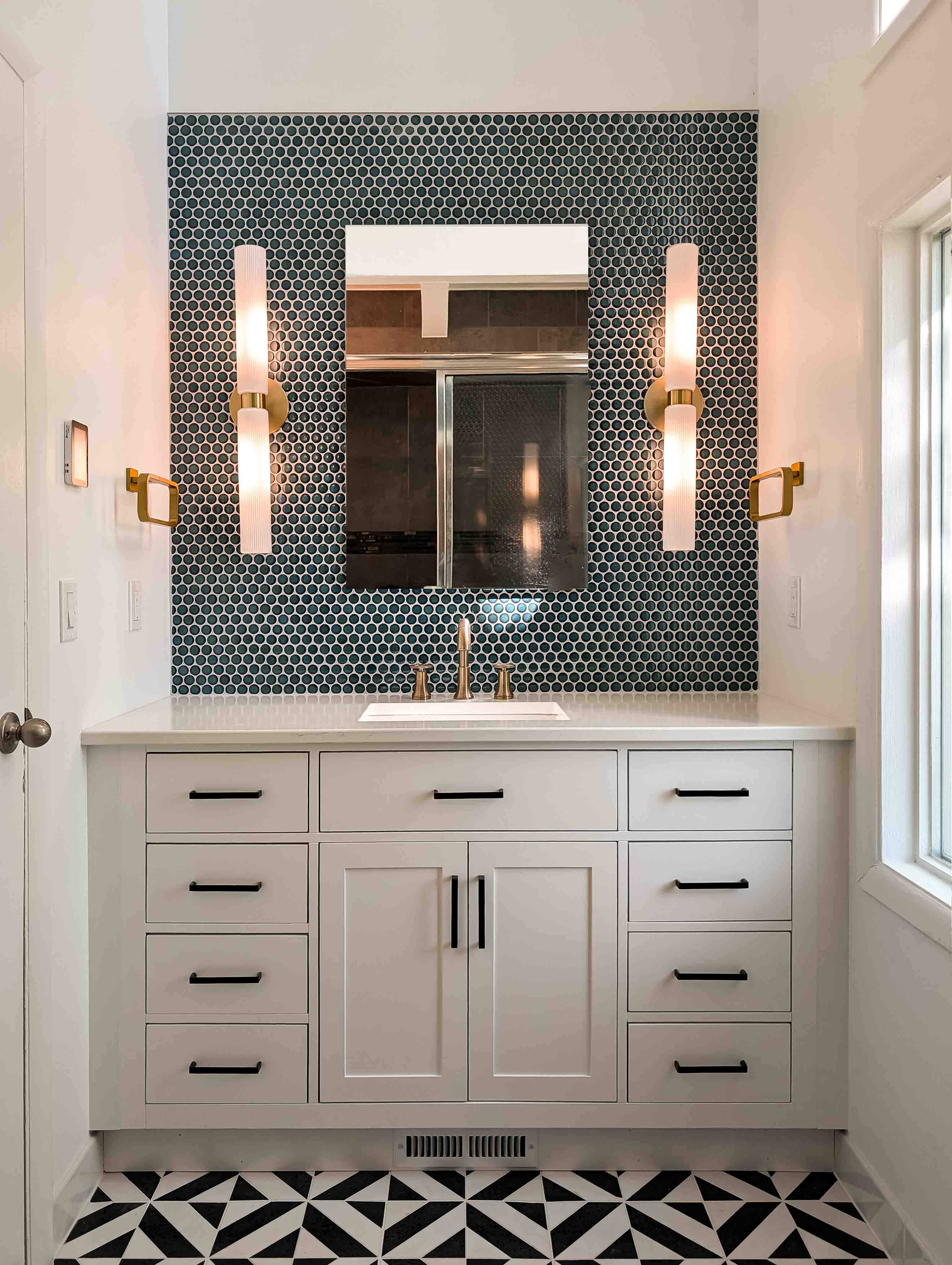 Modern bathroom remodel in Boulder, Colorado featuring sleek tile work, updated fixtures, and custom vanity—expertly designed and built by a Boulder-based home remodeling contractor. Colorado Choice Builders